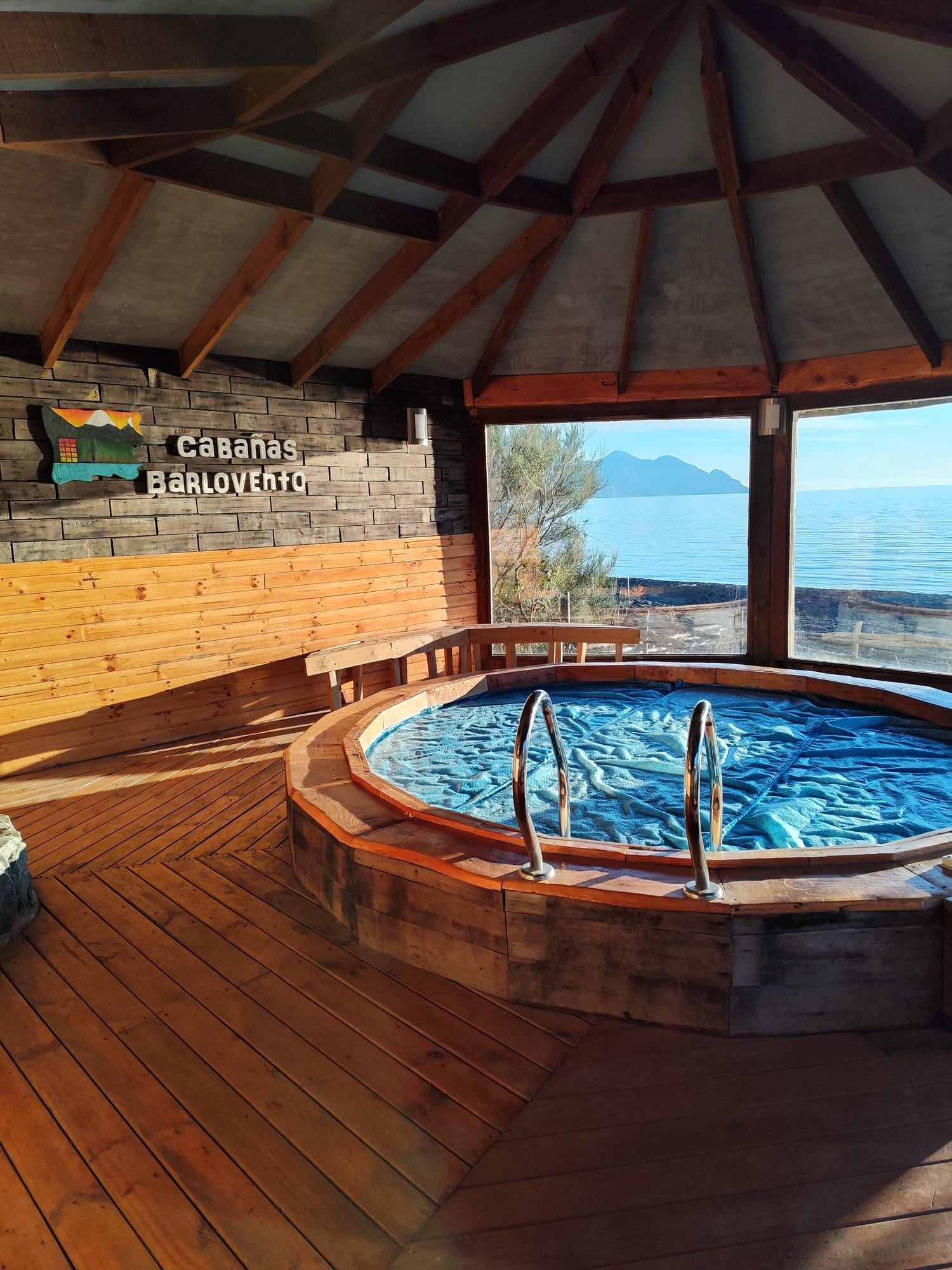 The heated pool of the beach house, with windows facing the lake