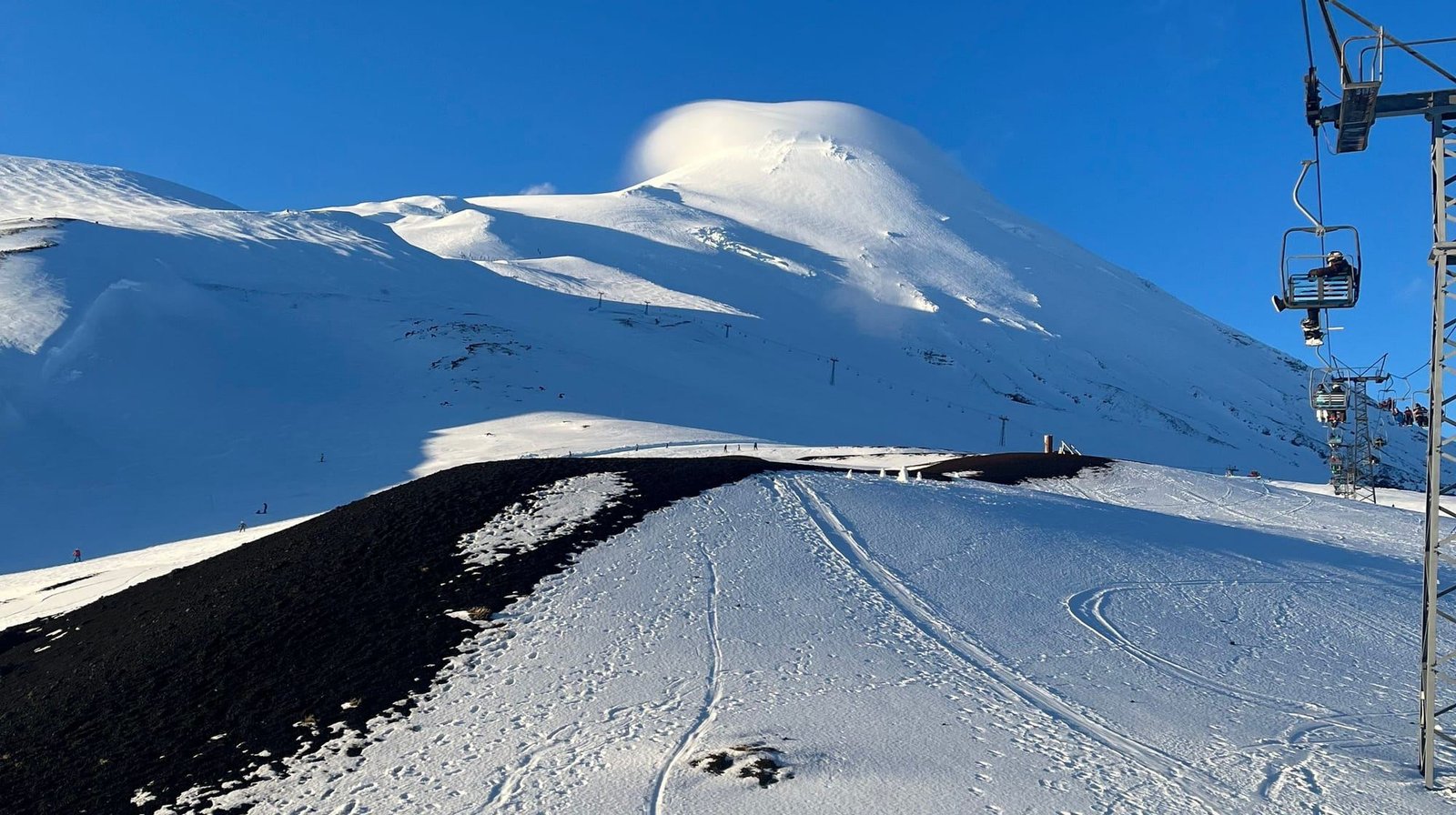 A snowy run and the chairlift of the Osorno Volcano ski resort