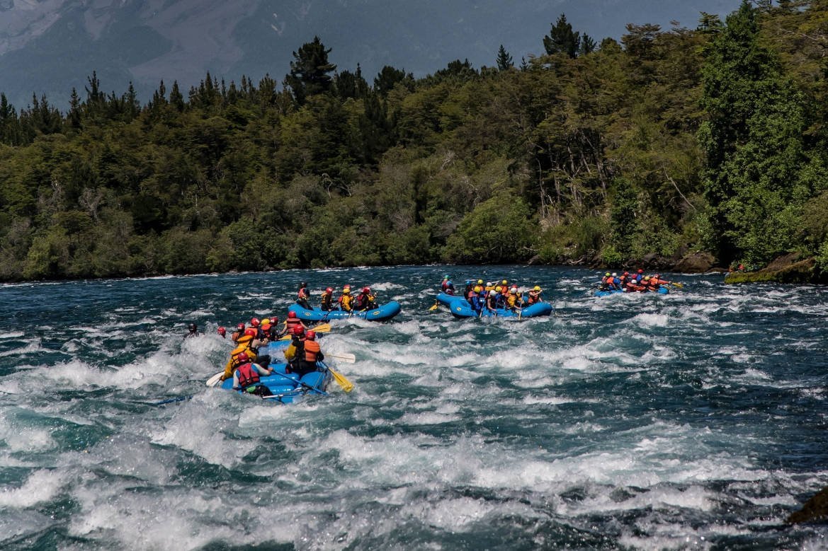Several rafts run the Petrohue River rapids through native forest